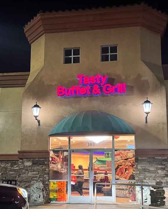 Restaurant entrance with buffet dining inside.